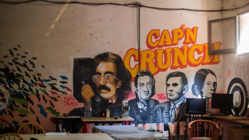 Cap'n Crunch (the 1970's telephone hacker) graffiti in a Calafou building